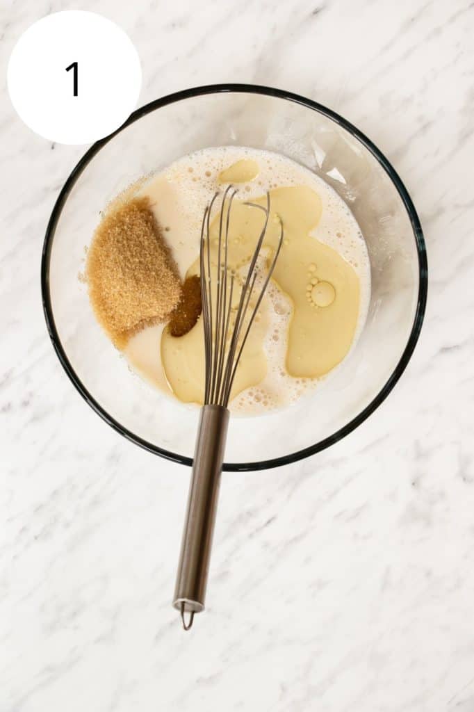 cupcake wet ingredients in mixing bowl with a whisk