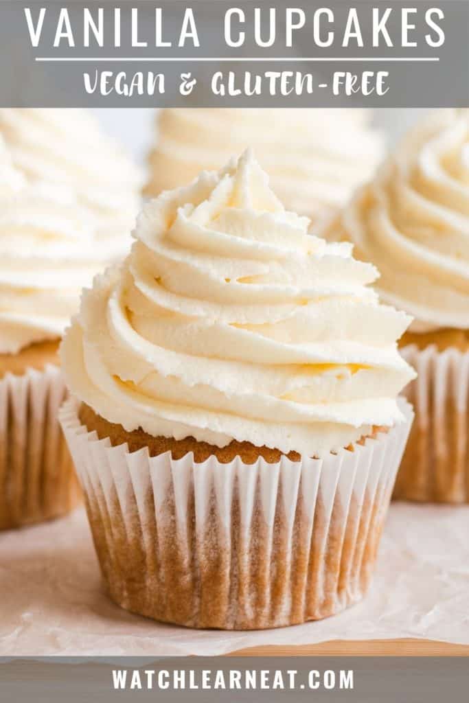 pin showing close-up front view of cupcake with frosting with some more in the background