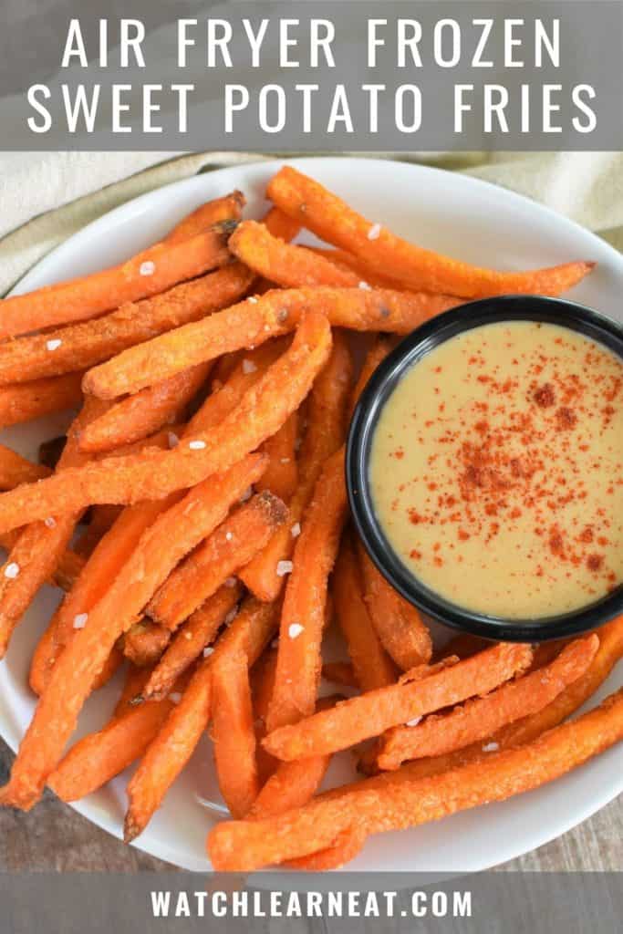 pin showing fries on a white plate with dipping sauce