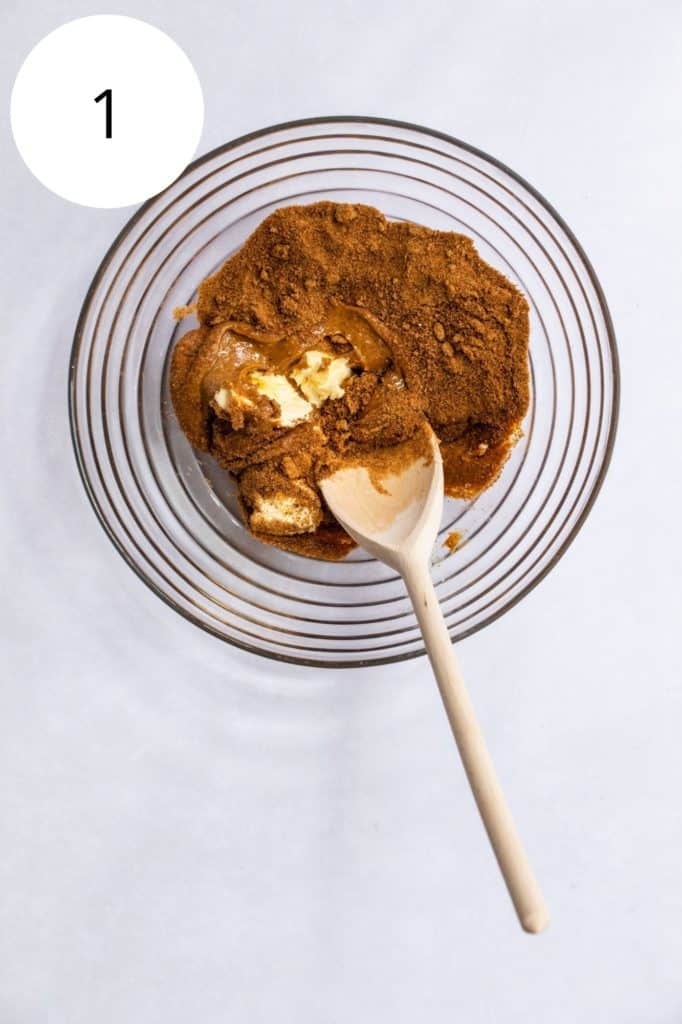 butter, peanut butter and sugar in mixing bowl with wooden spoon