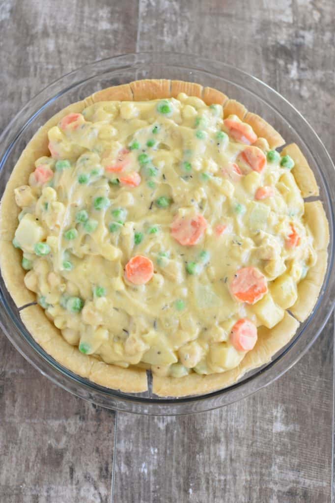 overhead of pot pie in pie shell before baking