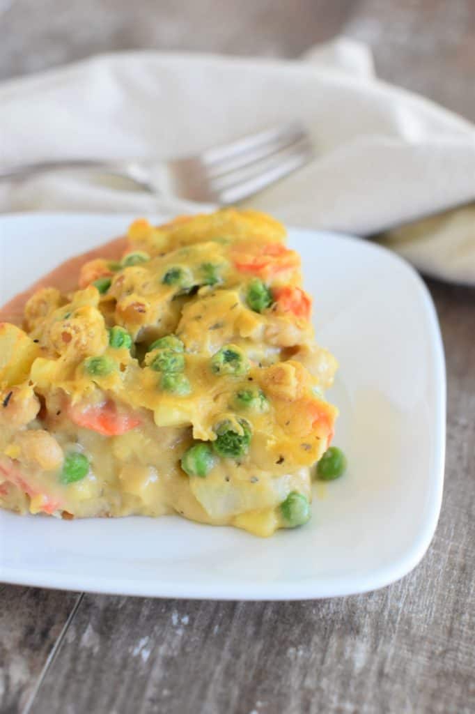 left side view of slice of pot pie on a white plate