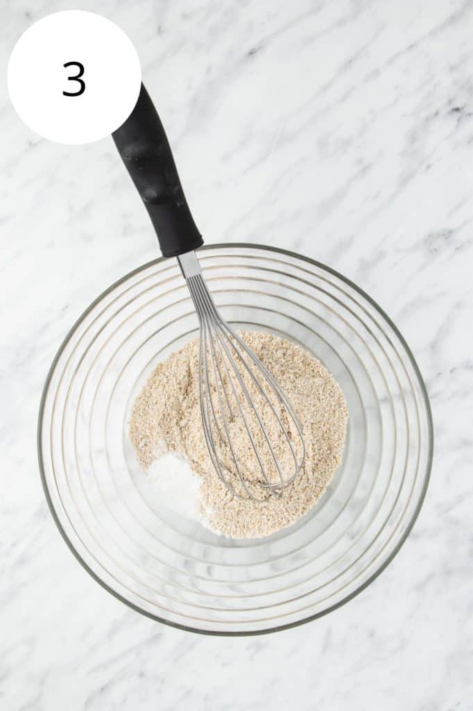 oat flour, baking powder, baking soda and salt in a mixing bowl with a whisk