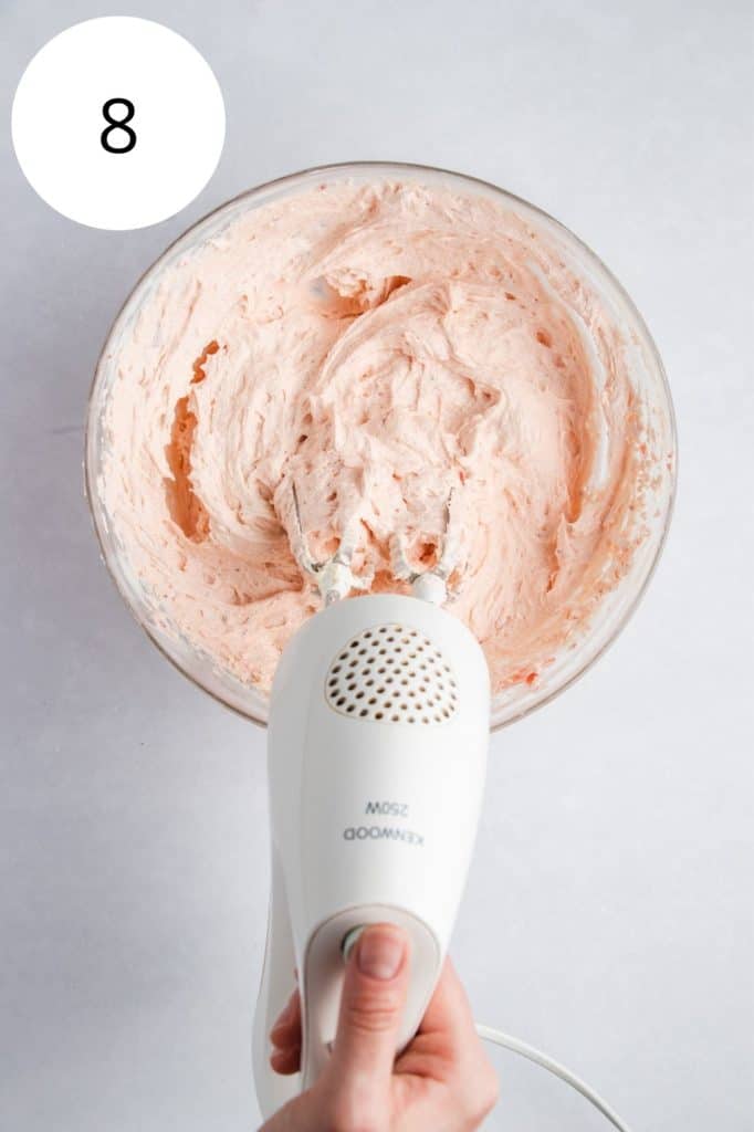 strawberry preserves whipped into the frosting in the mixing bowl