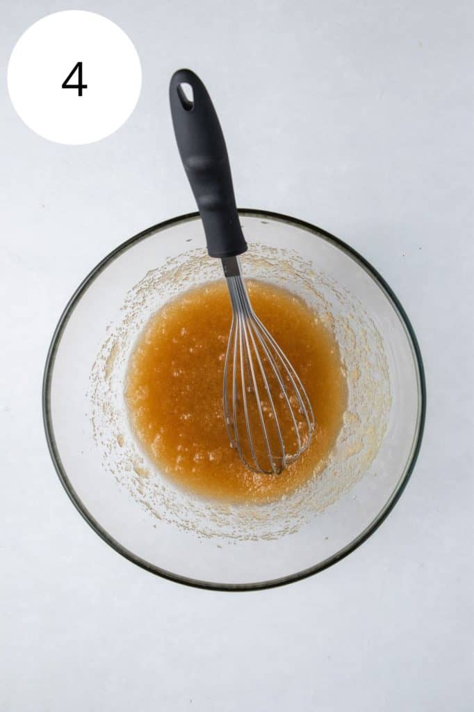 sugar and oil in mixing bowl after being whisked