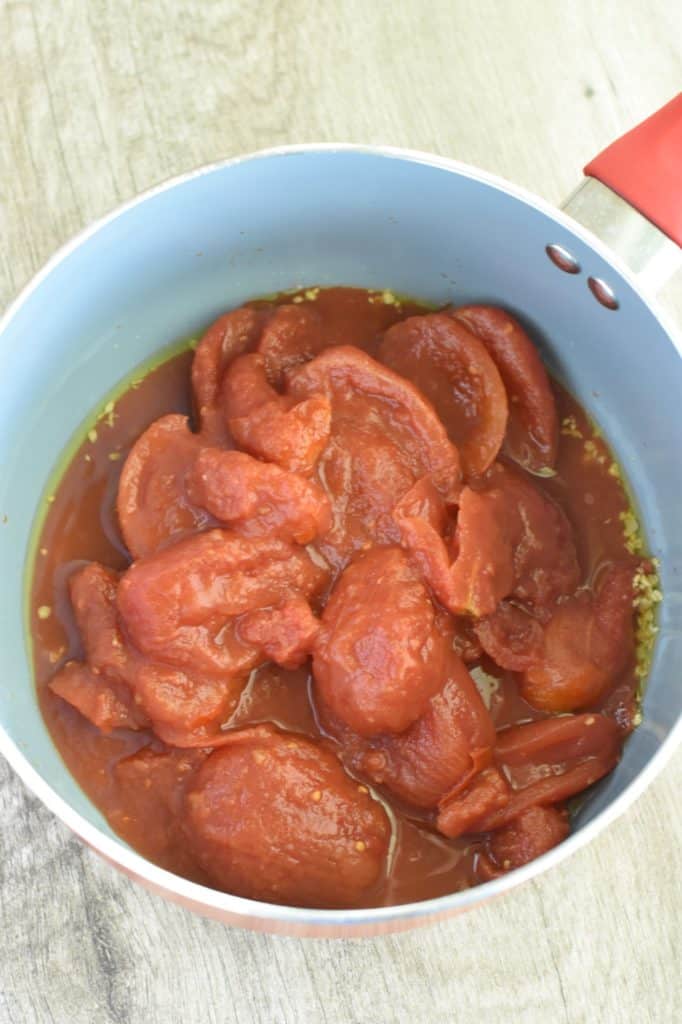 stewed tomatoes added to the pot.