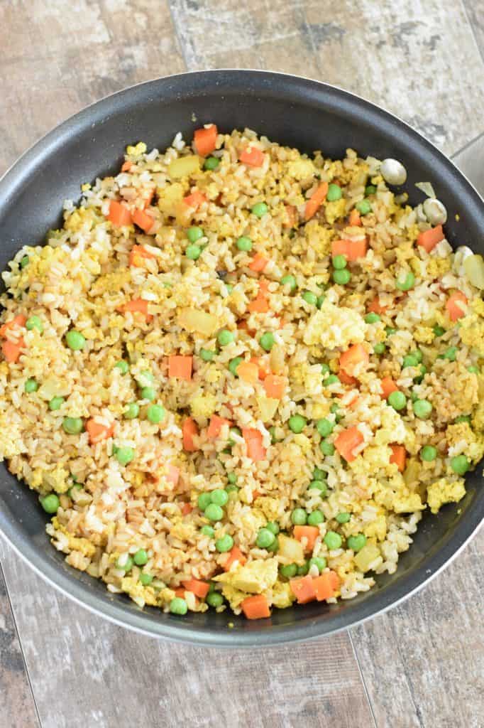 veggies, rice and tamari added to the pan with the tofu and onion