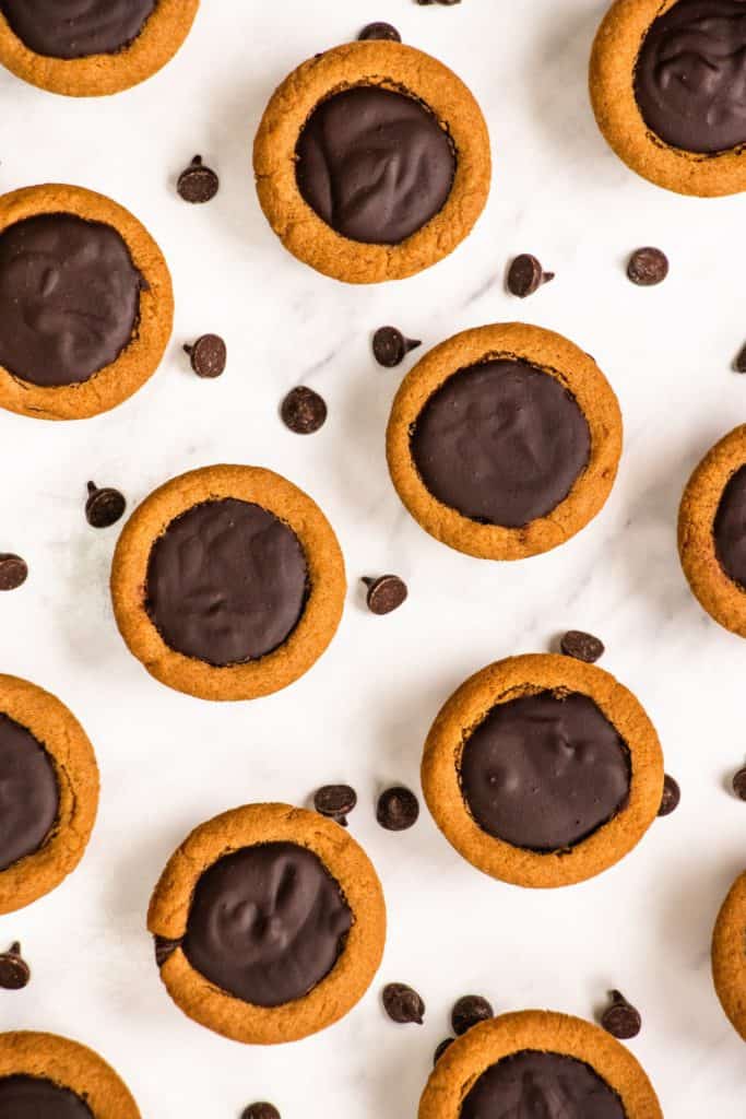 overhead of cookie cups with chocolate chips around them