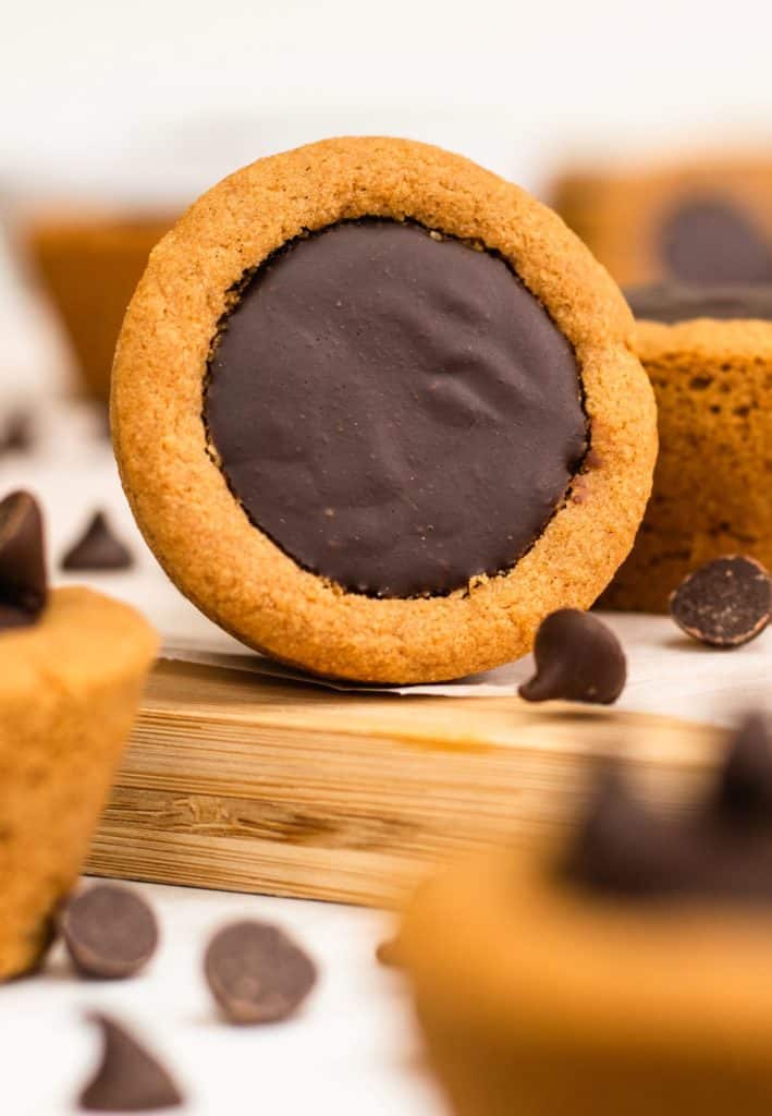 cookie cup on its side to show chocolate filling