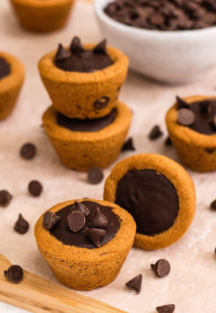 one cookie cup with some chips on top and another one next to it on its side