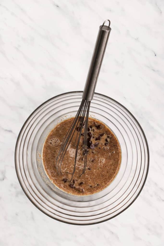 heated mixture poured over the chocolate chips in the mixing bowl