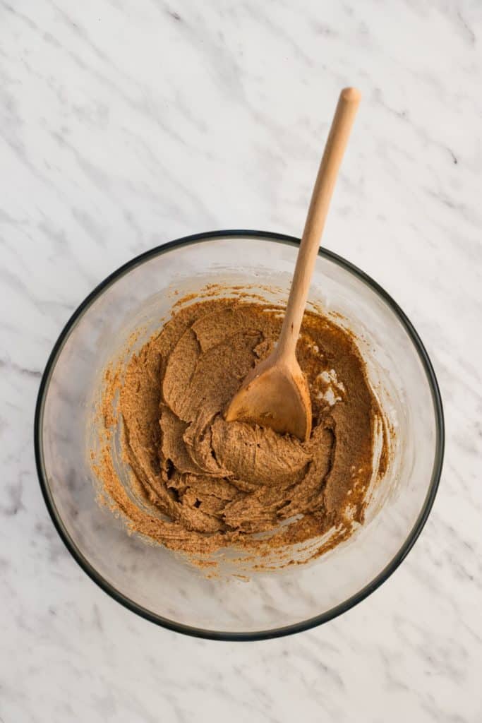 butter and sugar after being beat together with wooden spoon in the bowl