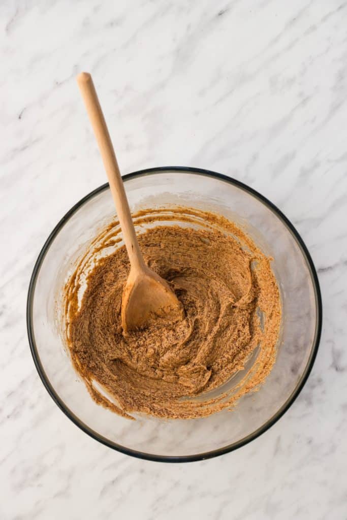 wet ingredients after being combined with wooden spoon in bowl