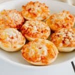 close-up front view of bagel bites on white plate