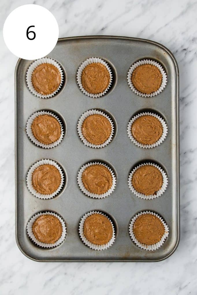 peanut butter layer added on top of the first layer of chocolate in the cupcake liners