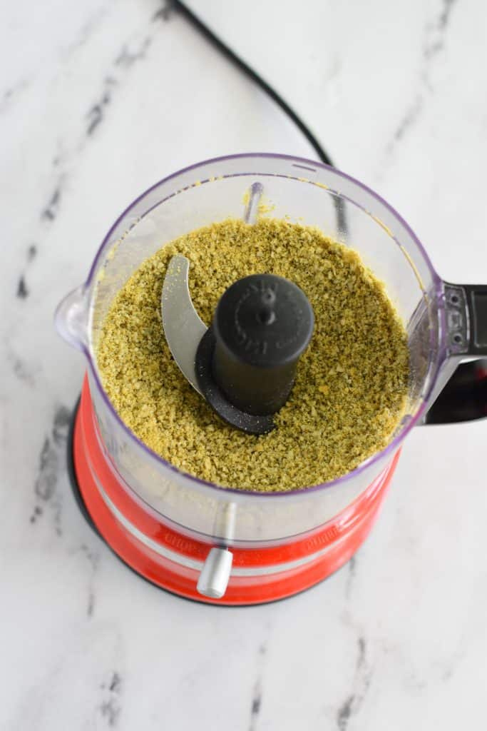 pumpkin seed Parmesan in food chopper after being processed