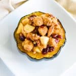 overhead of stuffed acorn squash on white plate