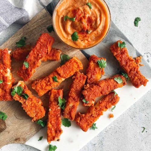 overhead of tofu Buffalo wings with side of dipping sauce