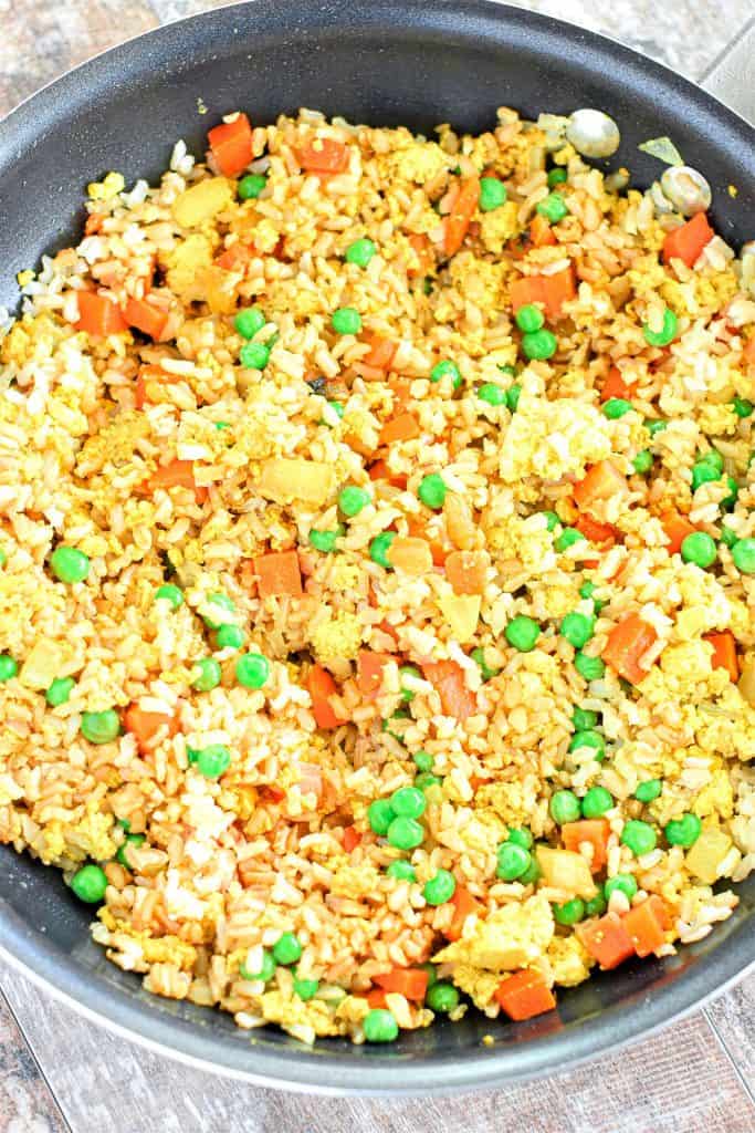 overhead of fried rice in non-stick skillet after cooking.