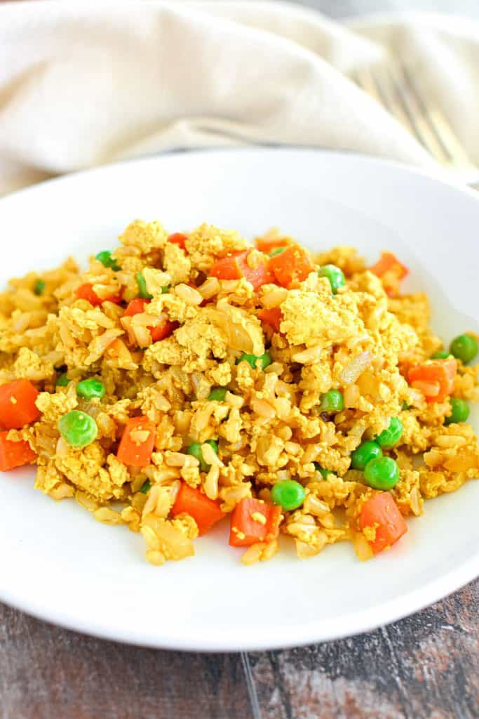 front view of fried rice on white plate.