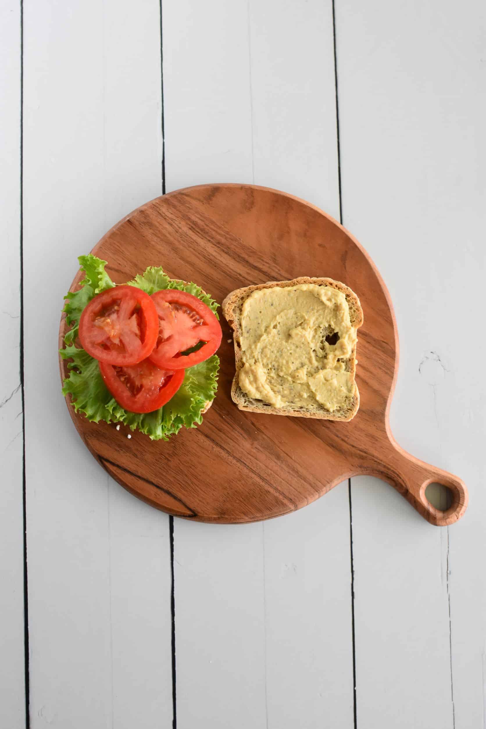 tomato slices added to one side of toast.