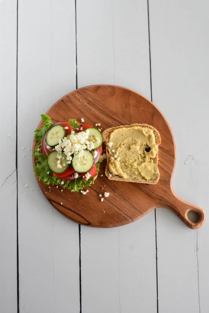 more vegan feta added on top of the veggies on one side of toast.