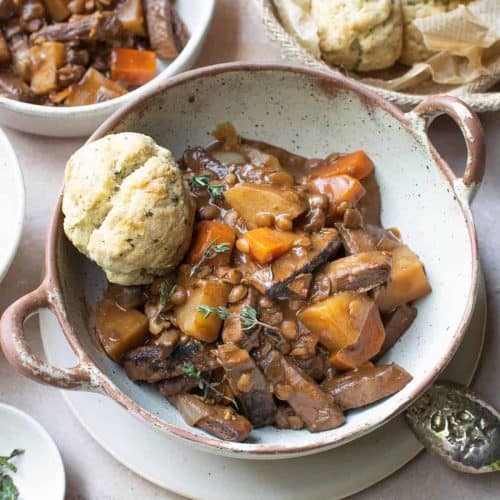 overhead of vegan beef stew with a biscuit.