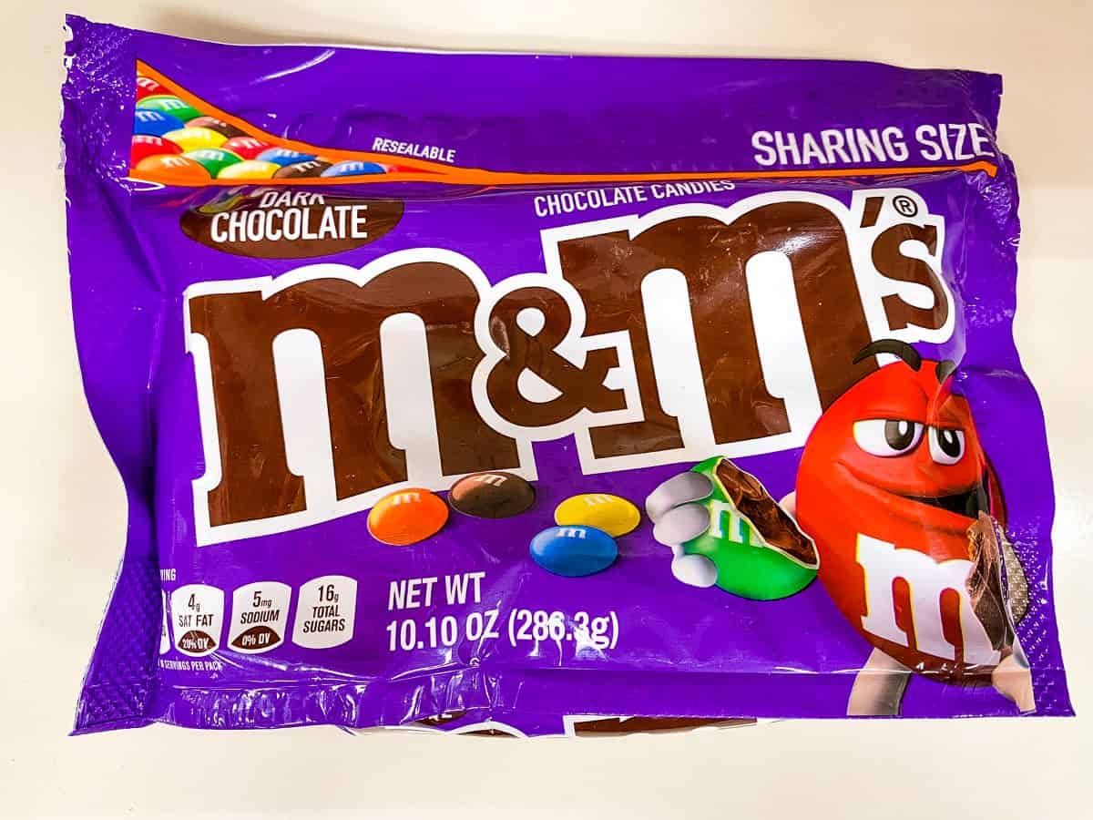 Bag of dark chocolate M&M's.