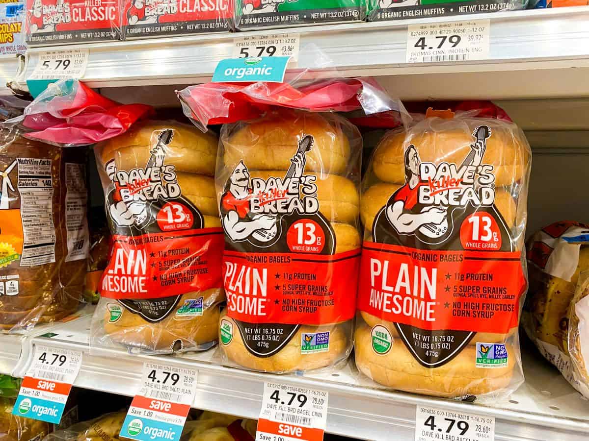 Dave's Killer Bread bagels on supermarket shelf.