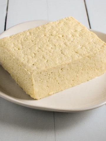 Front view of tofu on a plate.