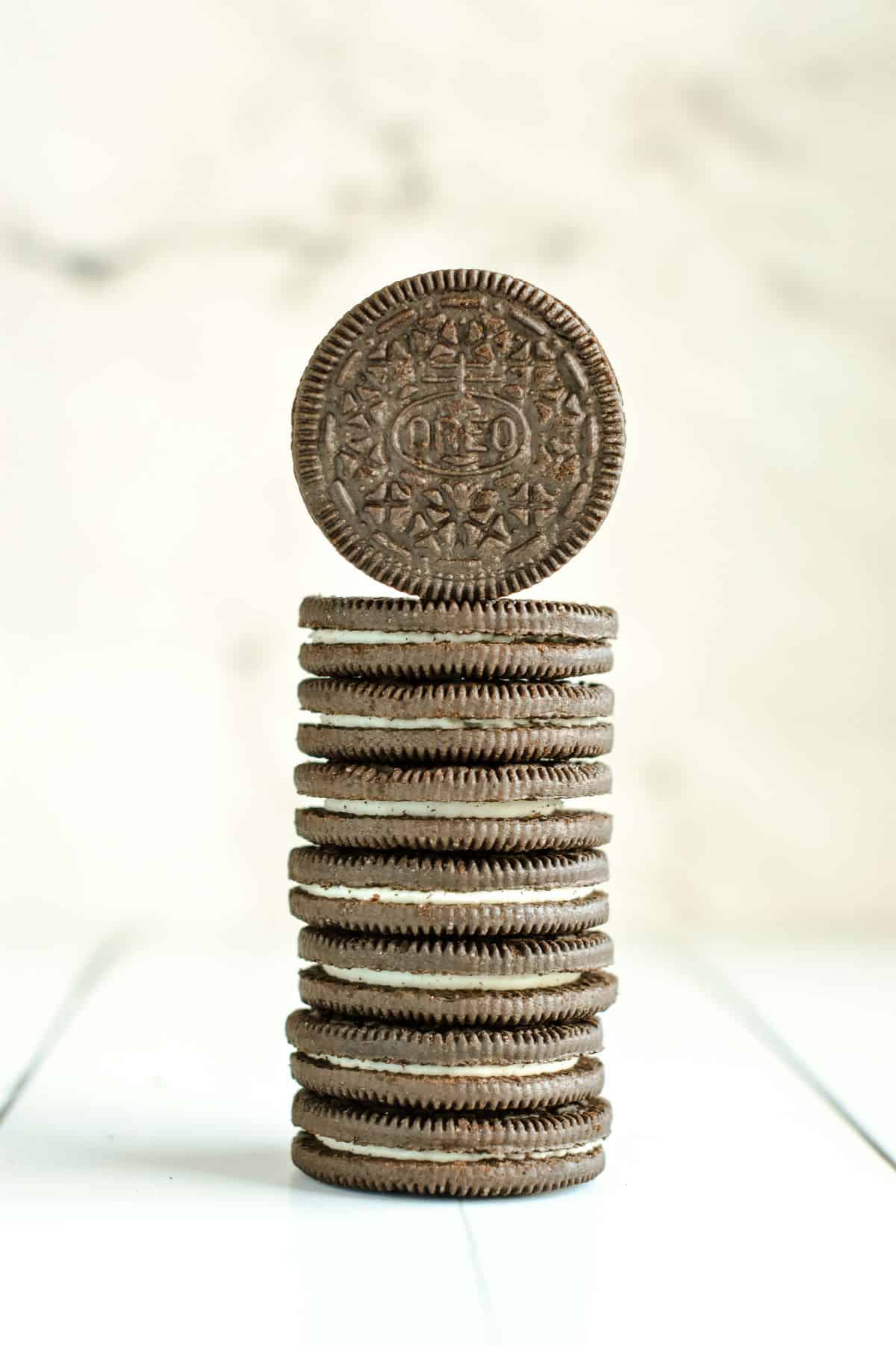 Stack of Chocolate Creme Oreos on a white table.