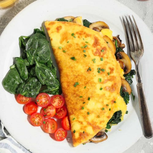 Just Egg Omelet on a white plate with a fork.