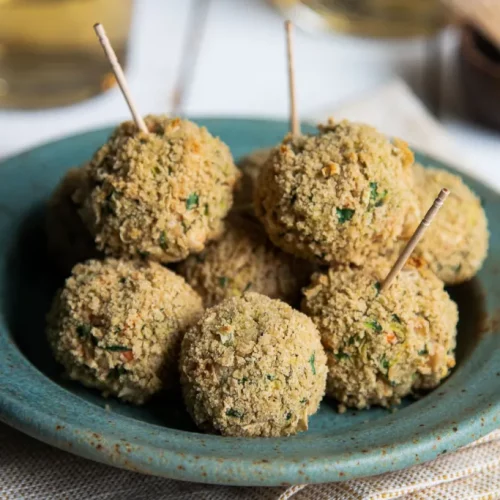 Vegan cannellini bean appetizer balls on a plate.