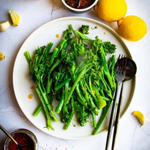 SAUTÉED BROCCOLETTE WITH GARLIC, LEMON AND ALEPPO CHILI on a plate.