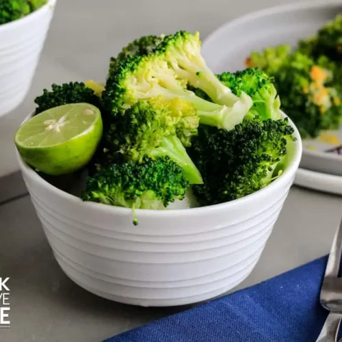 INSTANT POT BROCCOLI in a white bowl.