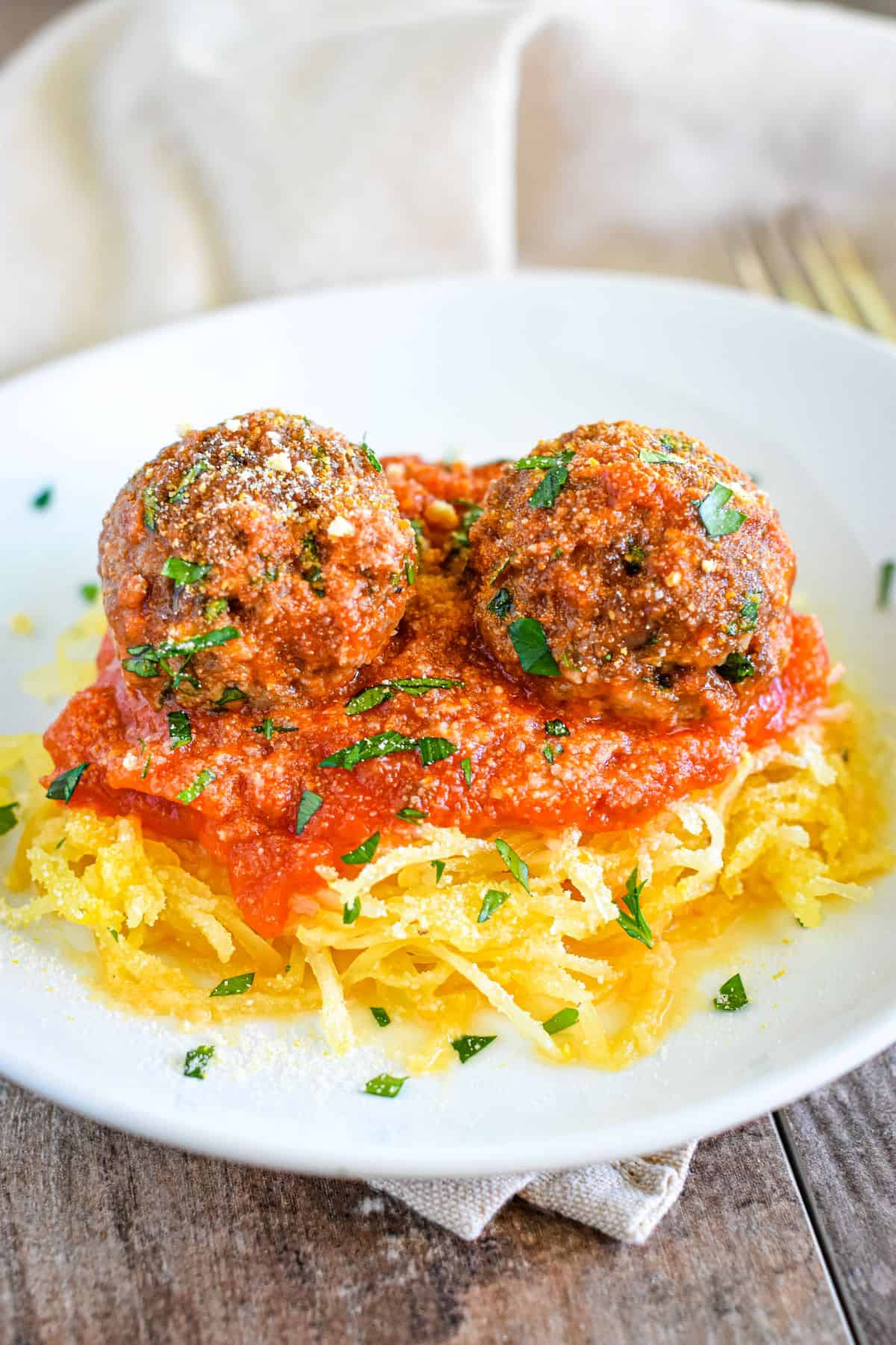 Impossible Burger Meatballs on top of noodles.