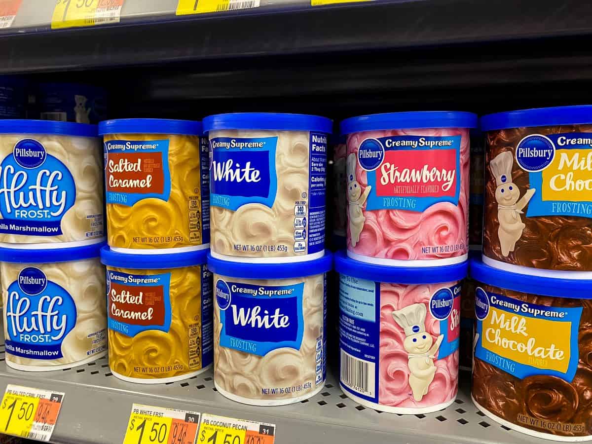 Pillsbury frosting on supermarket shelf.