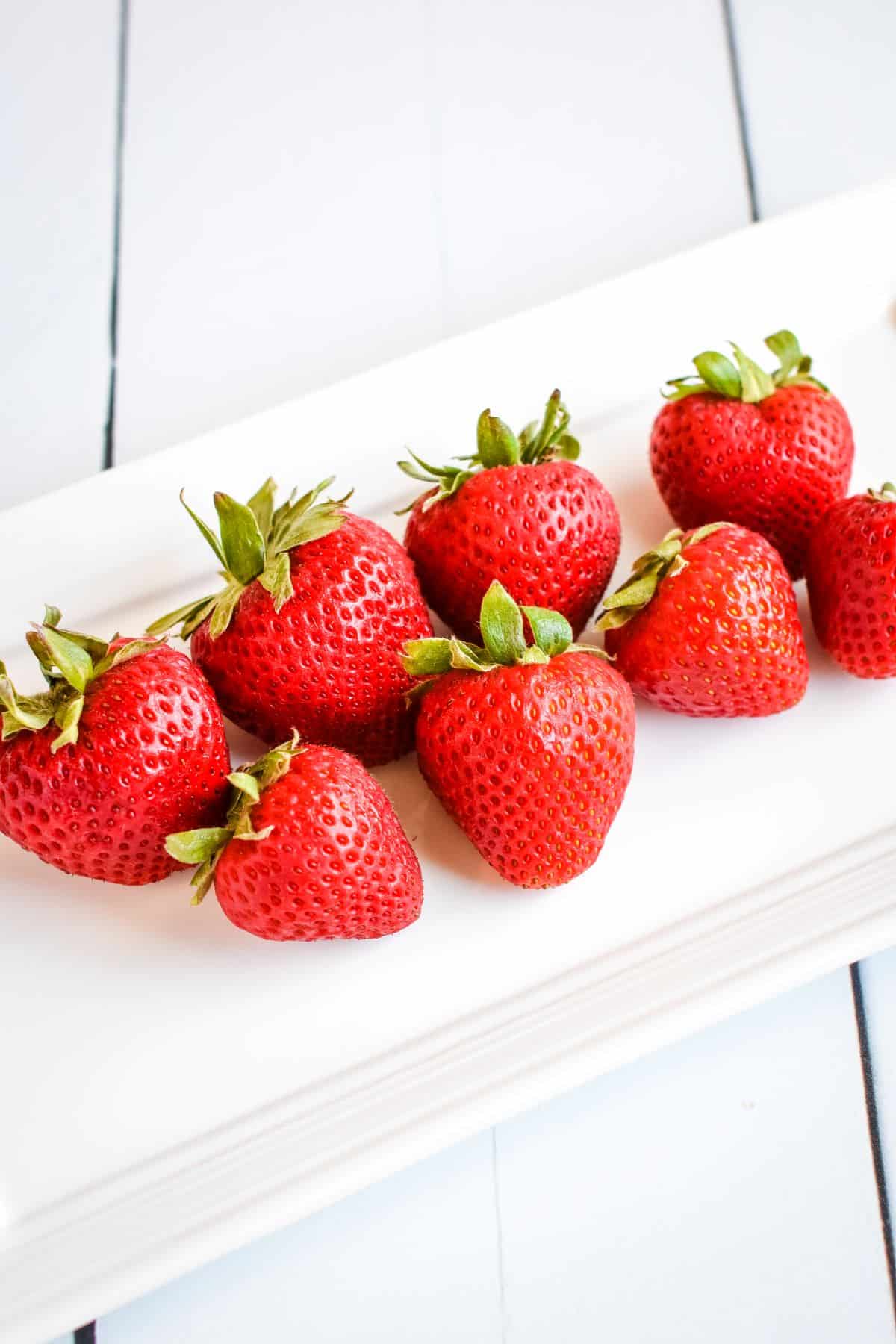 Strawberries on serving dish.