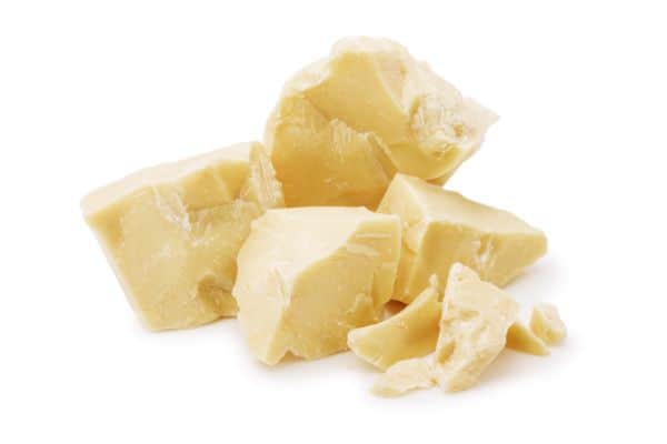 chunks of cocoa butter with a white background.