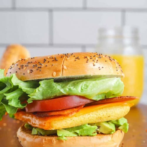 Vegan Breakfast Bagel on a wooden surface.