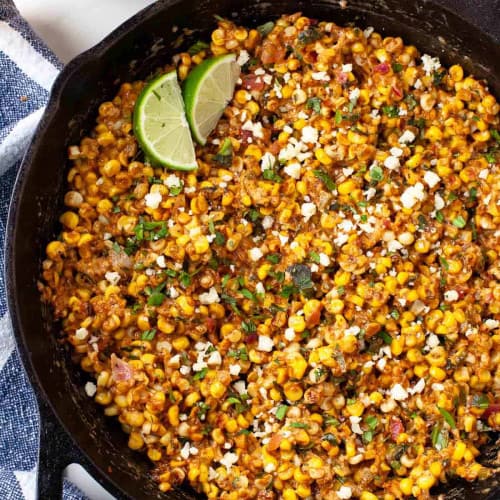 Mexican street corn dip in a frying pan.