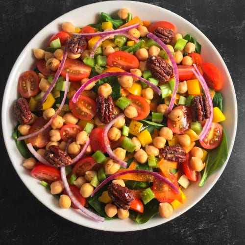 Vegan spinach salad recipe in a bowl.