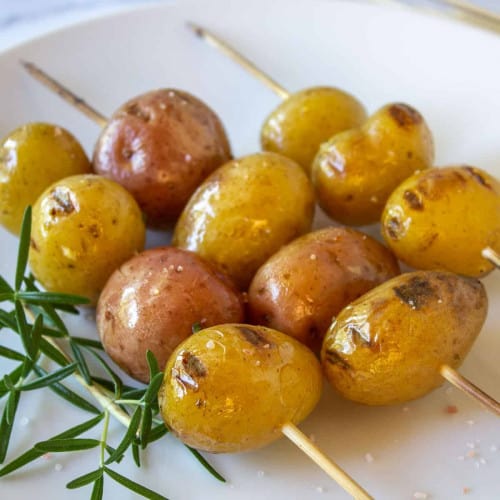 Grilled Baby Potatoes on wood skewers.