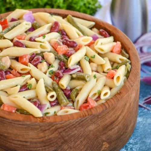 Three Bean Pasta Salad in a wooden bowl.