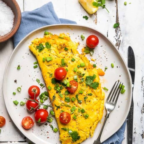 Vegan Omelet on a plate with a fork.