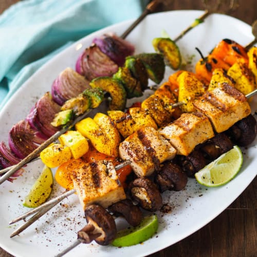 Vegan Tropical Tofu Skewer with Avocado and Mango on a dish.