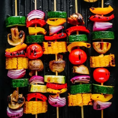 Veggie kabobs on a tray.