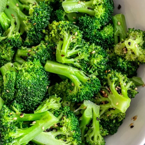 Asian sesame broccoli salad in a white bowl.