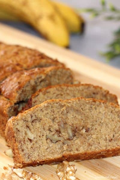 Slices of Air Fryer Banana Bread on a cutting board.