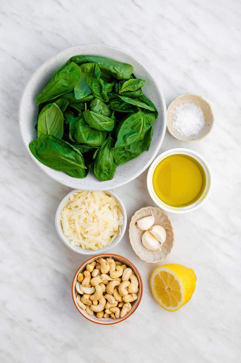 Gathered ingredients for making cashew pesto recipe.